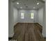 Bright room with hardwood floors, white walls and trim, recessed lighting, and natural light from windows at 333 W Bethany Home Rd, Phoenix, AZ 85013