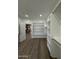 Spacious walk-in closet featuring custom shelving, wood floors, and ample storage at 333 W Bethany Home Rd, Phoenix, AZ 85013