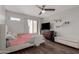 A sunny bedroom with updated dark wood flooring at 3600 N Hayden Rd # 2816, Scottsdale, AZ 85251