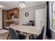 Cozy dining space with modern lighting, seating, and natural light from the window at 3600 N Hayden Rd # 2816, Scottsdale, AZ 85251