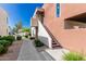 Exterior of a condo featuring a walkway, stairs, and landscaped surroundings at 3600 N Hayden Rd # 2816, Scottsdale, AZ 85251