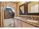 Elegant bathroom with double sinks, granite countertops, and a luxurious vanity mirror at 4112 W Monte Cristo Ave, Phoenix, AZ 85053