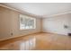 Bedroom with hardwood floors and white plantation shutters letting in lots of natural light at 4112 W Monte Cristo Ave, Phoenix, AZ 85053