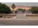 Charming single-story home with a spacious driveway and a well-manicured front yard, showcasing curb appeal at 4112 W Monte Cristo Ave, Phoenix, AZ 85053