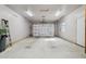 Spacious garage with insulated door, offering ample space for parking and storage at 4112 W Monte Cristo Ave, Phoenix, AZ 85053