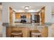 Kitchen features granite countertops, stainless appliances, and a convenient breakfast bar with seating at 4112 W Monte Cristo Ave, Phoenix, AZ 85053