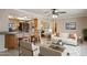 Inviting living space with an open layout, seamlessly connecting the kitchen, dining area, and living room at 4112 W Monte Cristo Ave, Phoenix, AZ 85053