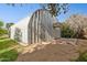 Exterior shot of a metal outbuilding with a door and window unit at 4112 W Monte Cristo Ave, Phoenix, AZ 85053