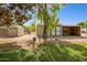 View of multiple storage sheds in the backyard setting, offering ample space for tools and equipment at 4112 W Monte Cristo Ave, Phoenix, AZ 85053