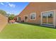Well-maintained backyard with artificial grass, patio seating, and easy access to indoor living spaces at 4204 S Winter Ln, Gilbert, AZ 85297