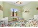 bedroom featuring natural light, play area, carpet and light green walls at 4204 S Winter Ln, Gilbert, AZ 85297