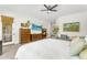 Bedroom with a TV, ceiling fan, and neutral decor at 4204 S Winter Ln, Gilbert, AZ 85297
