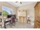 A bedroom featuring a Murphy bed, a modern desk, and a computer setup by the window at 4204 S Winter Ln, Gilbert, AZ 85297