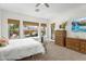 Bedroom with serene backyard views, a water feature, and wooden dressers at 4204 S Winter Ln, Gilbert, AZ 85297