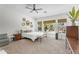 A spacious bedroom with pool views, bamboo blinds, and neutral tones at 4204 S Winter Ln, Gilbert, AZ 85297