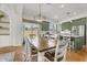 Dining area featuring a large wooden table and stylish light fixture at 4204 S Winter Ln, Gilbert, AZ 85297