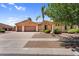 Charming home with a well-kept lawn and a three car garage at 4204 S Winter Ln, Gilbert, AZ 85297