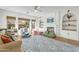 Cozy living room featuring a fireplace, built-in shelves and terracotta tile flooring at 4204 S Winter Ln, Gilbert, AZ 85297