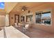 Charming outdoor patio features a ceiling fan and overlooks the scenic pool area at 4204 S Winter Ln, Gilbert, AZ 85297