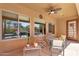 Inviting outdoor patio with ceiling fan, perfect for relaxing with beautiful pool views at 4204 S Winter Ln, Gilbert, AZ 85297