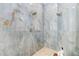 A stunning shower showcasing blue marbled tiles and dual shower heads at 4204 S Winter Ln, Gilbert, AZ 85297