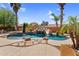 Stunning pool featuring a slide, lush landscaping, and a spacious patio area at 4204 S Winter Ln, Gilbert, AZ 85297