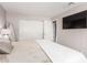 Inviting bedroom with plush bedding, mounted TV and ample closet space at 4600 N 68Th St # 302, Scottsdale, AZ 85251