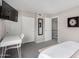 Stylish bedroom with white desk, mounted TV, sliding closet doors and modern decor at 4600 N 68Th St # 302, Scottsdale, AZ 85251