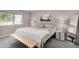 Bright bedroom with a comfortable queen-sized bed, stylish bedside lamps, and a cactus-themed art piece at 4600 N 68Th St # 302, Scottsdale, AZ 85251