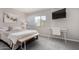 Bedroom with a comfortable queen-sized bed, stylish desk, and a decorative art piece at 4600 N 68Th St # 302, Scottsdale, AZ 85251