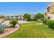 Well-maintained community lawn with beautiful plants and trees, offering a serene outdoor space for residents to enjoy at 4600 N 68Th St # 302, Scottsdale, AZ 85251