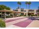 This desert community features an inviting shuffleboard, lush landscaping, and covered seating for outdoor enjoyment at 4600 N 68Th St # 302, Scottsdale, AZ 85251
