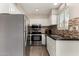 Well-equipped kitchen with stainless steel appliances and contrasting tile backsplash at 4600 N 68Th St # 302, Scottsdale, AZ 85251
