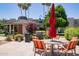 Community pool area with BBQ, seating, and lush landscaping at 4600 N 68Th St # 302, Scottsdale, AZ 85251