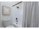 Bathroom featuring a shower with black fixtures, and a decorative curtain at 480 S Seawynds Blvd, Gilbert, AZ 85233