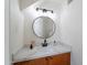Stylish powder room features a modern mirror, and a beautiful white marble countertop at 480 S Seawynds Blvd, Gilbert, AZ 85233