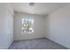 Bright and well-lit bedroom featuring a double-door closet and carpeted flooring at 480 S Seawynds Blvd, Gilbert, AZ 85233