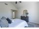 The bedroom is bright and spacious, with a dresser, mirror, and a large window at 480 S Seawynds Blvd, Gilbert, AZ 85233