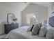 Bedroom featuring a large mirror and gray dresser at 480 S Seawynds Blvd, Gilbert, AZ 85233