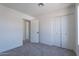 Bright bedroom with a carpet floor and a double door closet at 480 S Seawynds Blvd, Gilbert, AZ 85233