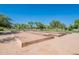 Bocce ball courts with wooden frames surrounded by green trees and landscaping in the community at 480 S Seawynds Blvd, Gilbert, AZ 85233