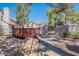 Inviting community entrance with landscaped pathway and charming bridge to pool area at 480 S Seawynds Blvd, Gilbert, AZ 85233