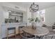Dining area adjacent to the kitchen features a stylish light fixture and seating for four at 480 S Seawynds Blvd, Gilbert, AZ 85233
