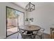 Charming dining area features a modern light fixture and sliding glass doors to the outside patio at 480 S Seawynds Blvd, Gilbert, AZ 85233