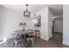 Cozy dining area with views into kitchen and stainless steel refrigerator at 480 S Seawynds Blvd, Gilbert, AZ 85233