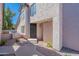 Inviting front entrance with a secure metal gate, desert landscaping, and a well-lit entryway at 480 S Seawynds Blvd, Gilbert, AZ 85233