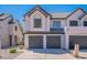 Charming townhome featuring a gray tile roof, a two-car garage, and a well-maintained yard at 480 S Seawynds Blvd, Gilbert, AZ 85233