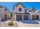 Charming townhome featuring a gray tile roof, a two-car garage, and a well-maintained yard at 480 S Seawynds Blvd, Gilbert, AZ 85233
