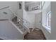 Bright foyer features wood-look floors, a staircase, and a view of the upper level at 480 S Seawynds Blvd, Gilbert, AZ 85233