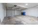 Two car garage with dual doors and concrete floor at 480 S Seawynds Blvd, Gilbert, AZ 85233